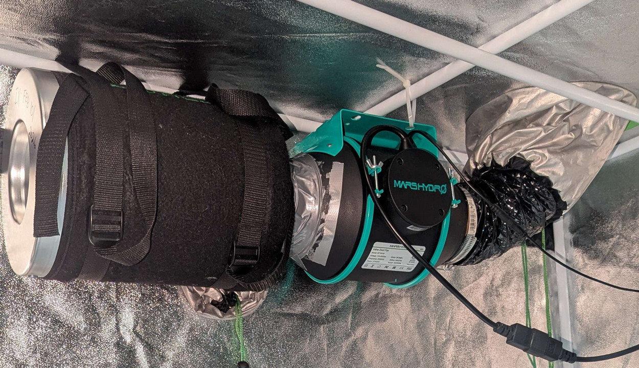 An inline fan with carbon filter and ducting.
