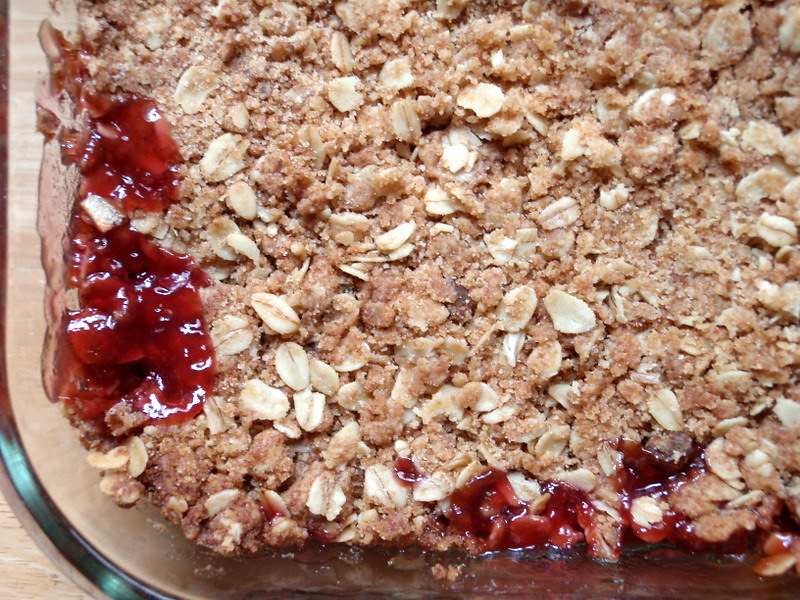 A baking dish filled with apple cranberry fruit crisp.