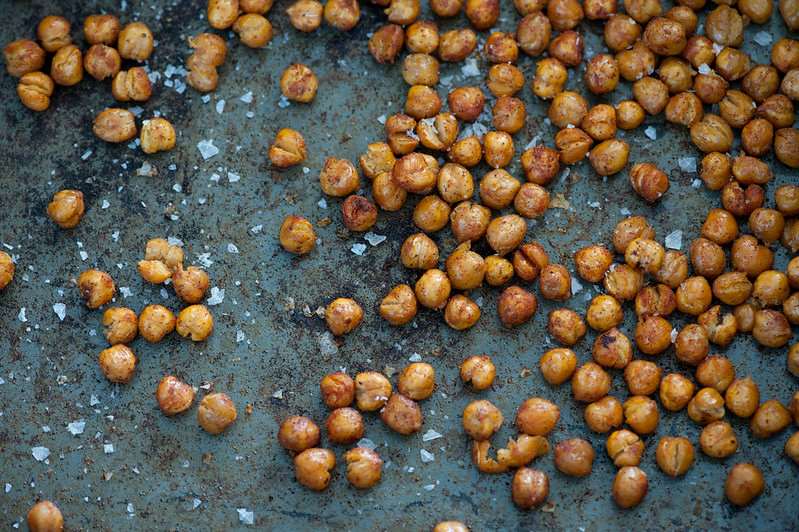 Roasted chickpeas on a baking sheet.