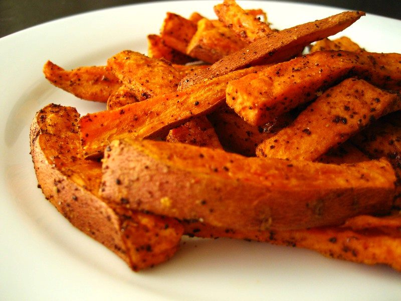 A plate with sweet potato fries.