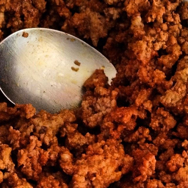 Ground beef spiced with taco seasonings in a pan